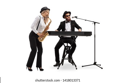 Full Length Shot Of A Young Woman Playing A Sax And A Man Playing Keyboards Isolated On White Background