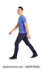 Full Length Side Portrait Of Happy Asian Man Walking Over White Background