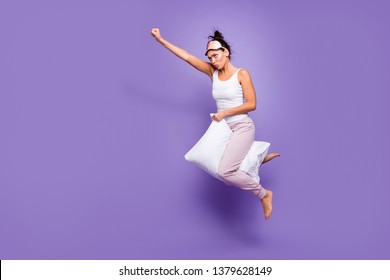 Full length side profile body size photo beautiful she her lady super power flight hold between legs pillow funny satisfied wear sleeping mask pants tank-top pajamas isolated violet purple background