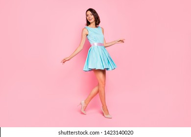 Full length side profile body size photo beautiful she her lady going graduation college university school walking street wear high-heels colorful blue dress isolated pink bright vivid background - Shutterstock ID 1423140020