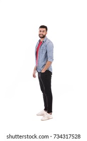 Full Length Side Shot Of Handsome Beard Man Wearing Jeans Shirt And Black Pants, Guy Smiling And Standing Confidently, Isolated On White Background