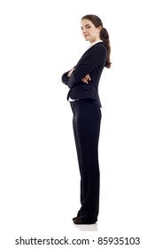 Full Length, Side View Of A Confident Young Business Woman Standing With Folded Hands Isolated Over White Background