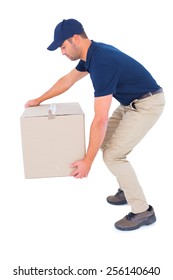 Full Length Side View Of Courier Man Picking Up Cardboard Box On White Background