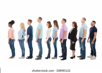 Full Length Side View Of Creative Business People Standing In Row Against White Background