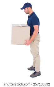Full length side view of delivery man carrying cardboard box on white background