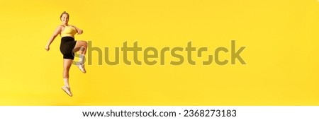 Full length side view portrait of plus size woman dressed sporty training against over yellow background. Concept of sport, hobby, health, lifestyle, healthy eating, workout. Banner. copy space. ad
