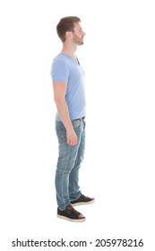 Full Length Side View Of Young Man Standing Isolated On White Background