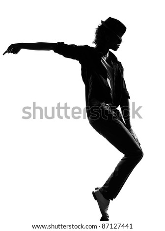 full length silhouette of a young man dancer dancing funky hip hop r&b on  isolated  studio white background