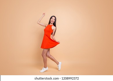 Full Length Size Studio Photo Portrait Of Beautiful Charming Good Mood Toothy Beaming Smile Tender Careless Carefree Cheerful Gorgeous Korean Teen Lady Holding Skirt Isolated Pastel Beige Background