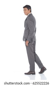 Full Length Snap Figure, Business Man Stand In Dark Gray Suit Pants And Brown Shoes, Studio Lighting White Background Isolated, Walking