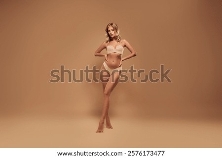 Full length studio portrait of seductive lady dressed lingerie love herself copy space isolated ivory color background