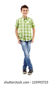 Full Length Studio Portrait Of A Teen Boy In Green Plaid Shirt With Hands In His Pockets