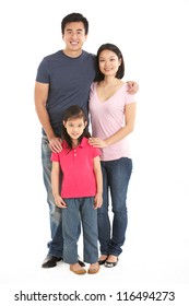 Full Length Studio Shot Of Chinese Family