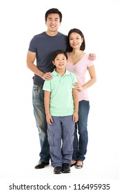 Full Length Studio Shot Of Chinese Family