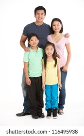 Full Length Studio Shot Of Chinese Family