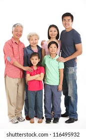 Full Length Studio Shot Of Multi-Generation Chinese Family