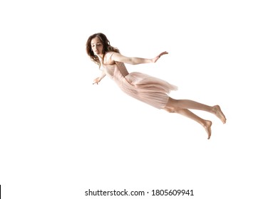 Full length studio shot of young woman hovering in air