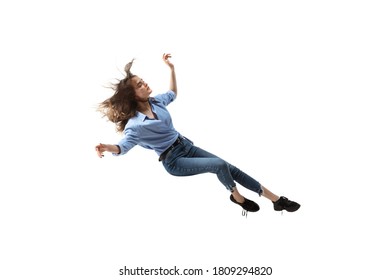 Full length studio shot of young woman hovering in air