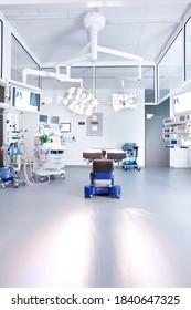 A Full Length Vertical View Of A Modern Operating Room Equipped With Advanced Medical Machinery And High-end Equipment