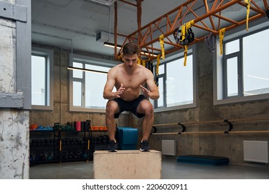 Full Length View Image Of The Fit Young Man Doing Box Jump Exercise