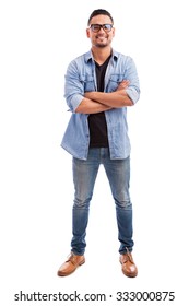 Full Length View Of A Young Man Wearing Glasses And Dressed Casually Against A White Background