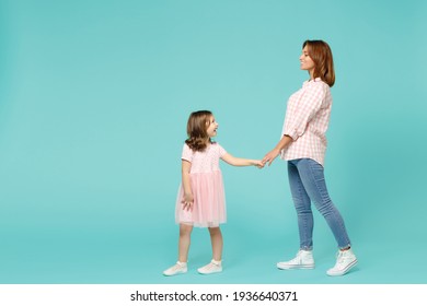 Full Length Woman In Pink Clothes Have Fun With Child Baby Girl 5-6 Years Old. Mommy Little Kid Daughter Walk Go Step Isolated On Pastel Blue Azure Background Studio. Mother's Day Love Family Concept