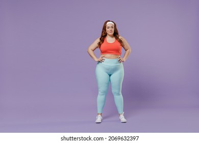 Full Length Young Chubby Overweight Plus Size Big Fat Fit Woman Wear Red Top Warm Up Training Stand Akimbo Arm On Waist Isolated On Purple Background Studio Home Gym. Workout Sport Motivation Concept