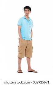 Full Length Young Man In Shorts Standing Posing In Studio 