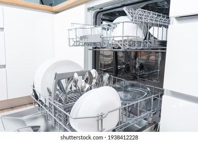 Full Load Dishwashing Machine. Clean Dishes And Cutlery