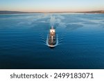 Full loaded dry cargo bulk carrier or bulker in underway in sea, aerial footage