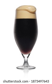 Full misted glass of black stout dark beer isolated on a white background.