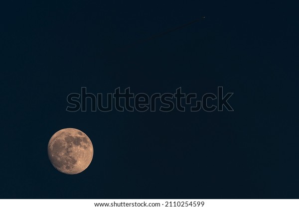 Full moon and airplane in\
January.