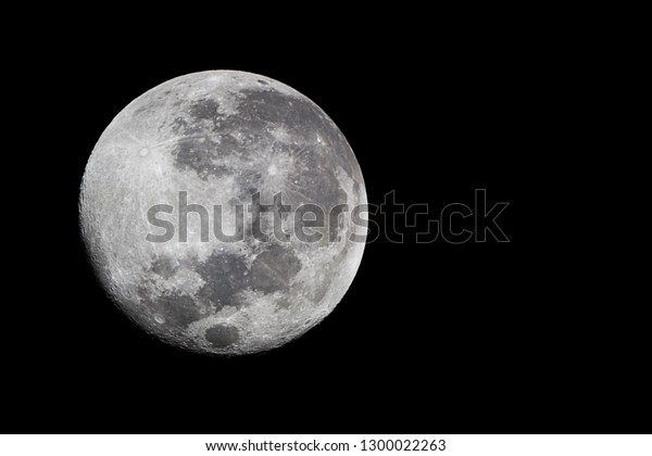 Full moon /\
The Moon is an astronomical body that orbits planet Earth and is\
Earth\'s only permanent natural satellite. It is the fifth largest\
natural satellite in the Solar\
System