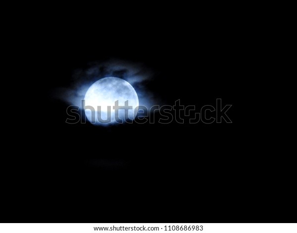 Full Moon background / The Moon is an astronomical
body that orbits planet Earth and is Earth's only permanent natural
satellite. It is the fifth-largest natural satellite in the Solar
System