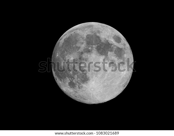 Full moon background / The full moon is the lunar\
phase when the Moon appears fully illuminated from Earth\'s\
perspective. This occurs when Earth is located directly between the\
Sun and the Moon