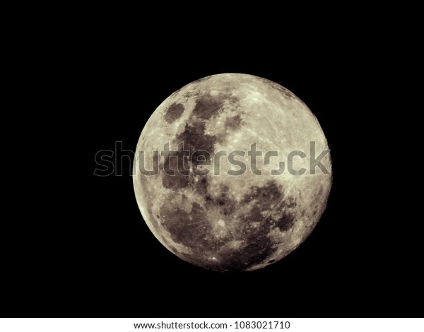Full moon background / The full moon is the lunar\
phase when the Moon appears fully illuminated from Earth\'s\
perspective. This occurs when Earth is located directly between the\
Sun and the Moon
