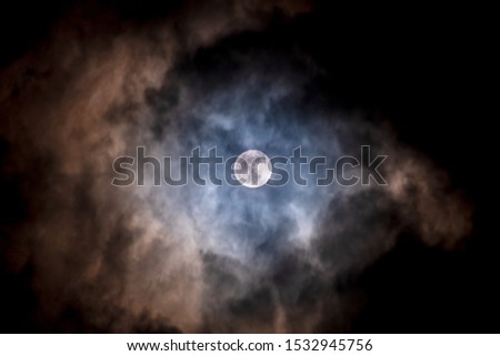 Full moon black background with clouds detail surface