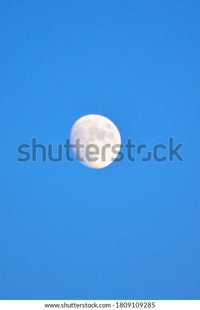 Full Moon with blue\
dusk sky background