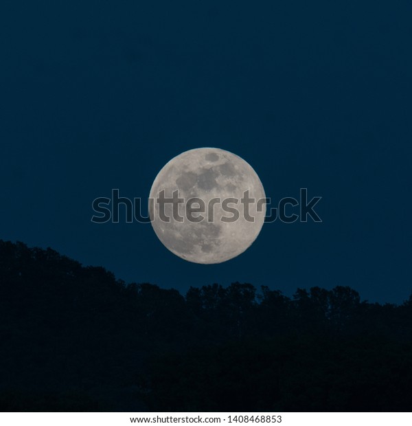 Full moon in blue\
sky