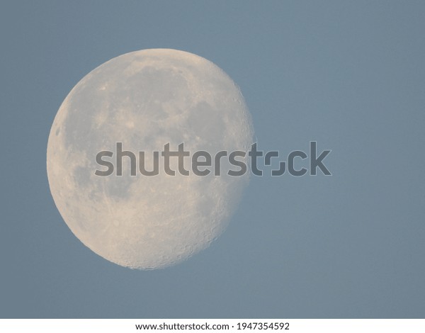 full moon with blue sky\
as background