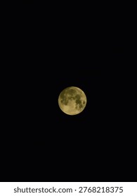 Full moon a celestial orb illuminating the black night sky for astronomy astrology or lunar cycle content