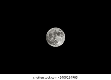 Full moon close up photo. Close up of full Luna. Detail of moon surface. Isolated background. Full moon closeup showing the details of the lunar surface. The Moon isolated on a black. Explorer space