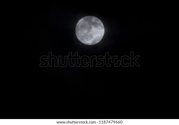 Full moon and cloud in dark sky at\
night,Closeup. / Full Moon at Night on\
background.