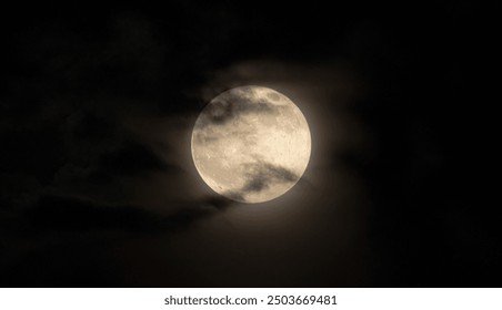 Full moon with clouds at the front