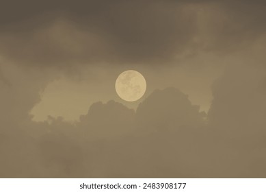 Full moon with clouds in the sky.