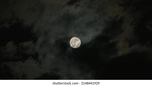Full moon with cloudy nigh sky as background