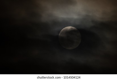 Full Moon in Cloudy Sky