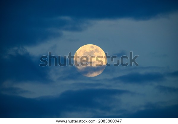 full moon in the\
daytime