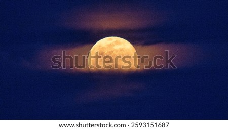   Full moon disk time lapse with moon light up in night dark black sky. Half moon on the dark blue sky. Elements of this image furnished by NASA