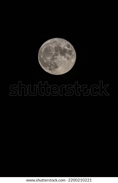 Full\
moon. Earth\'s natural satellite. Vertical\
image.